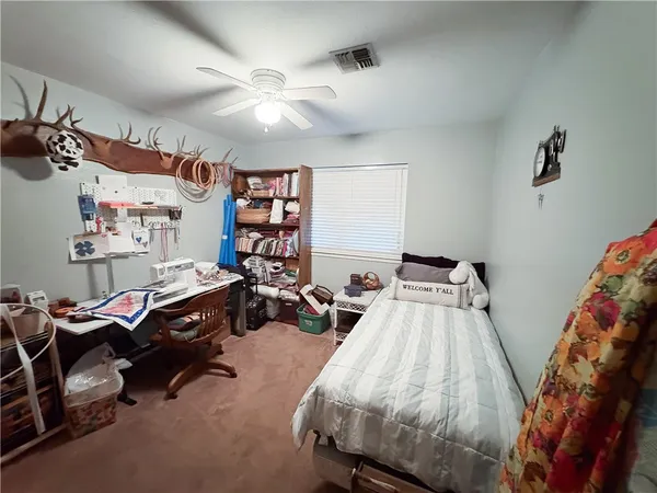 a bedroom with furniture and a bed