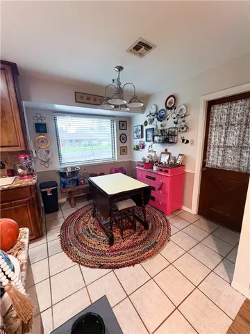 a living room with furniture a rug and a large window