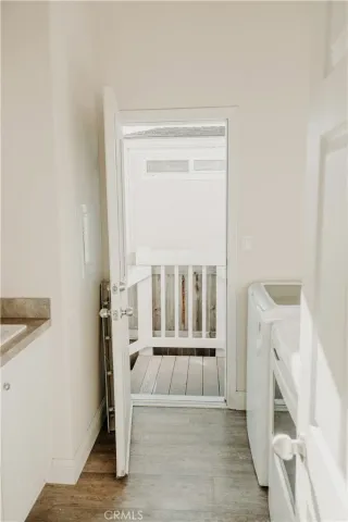 a view of entryway with wooden floor
