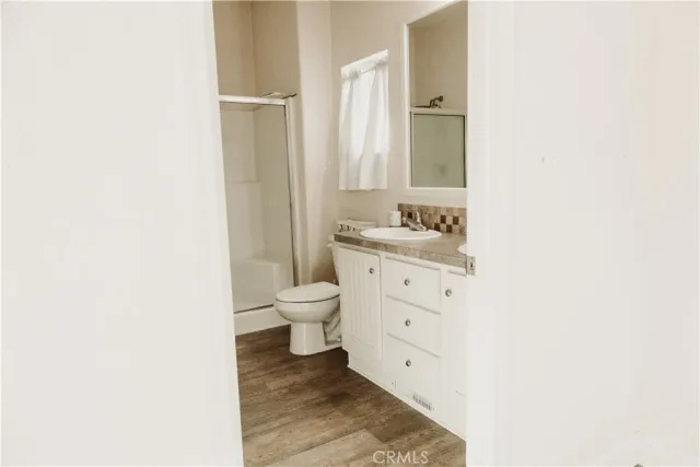 a bathroom with a sink toilet and vanity