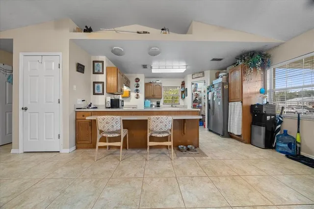 a view of a livingroom with furniture and a fan