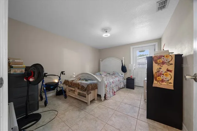 a bedroom with a bed and walk in closet