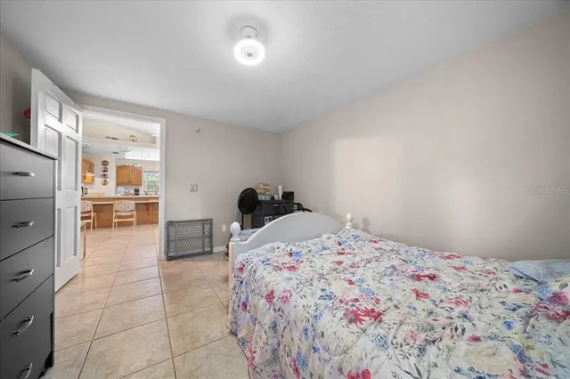 a bedroom with a bed and a cabinets