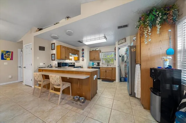 a view of a livingroom with furniture and a ceiling fan
