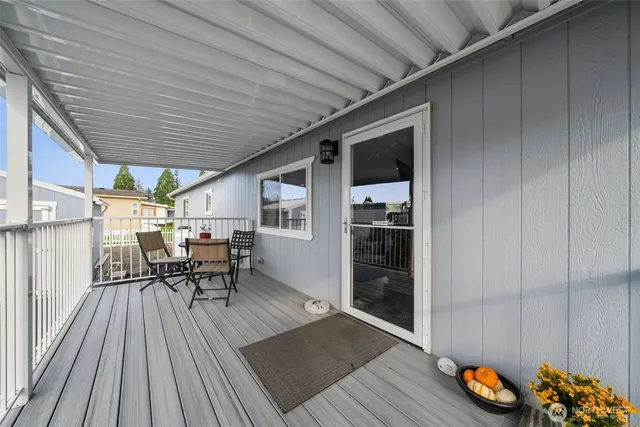 a patio with table and chairs