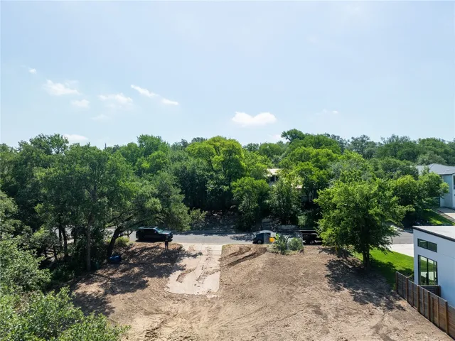 a view of a big yard with lots of green space