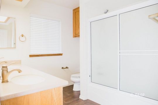 331 West Pilgrim Court Ridgecrest, CA 93555 - Photo 27 of 35 a bathroom with a sink a toilet and shower