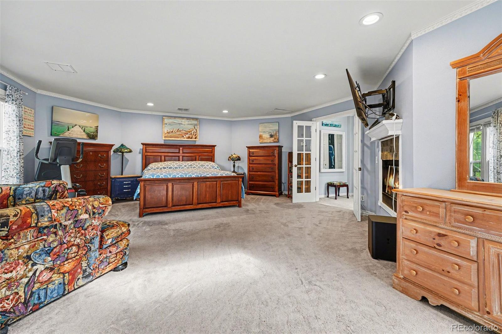 6650 North Village Road Parker, CO 80134 - Photo 15 of 46 a bedroom with furniture and a dresser