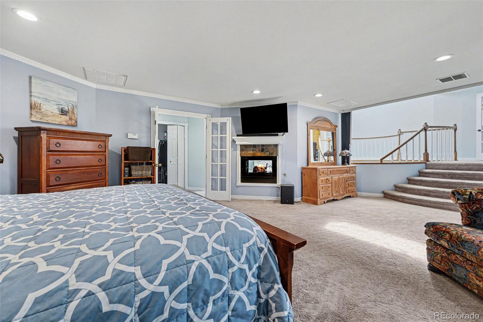 6650 North Village Road Parker, CO 80134 - Photo 17 of 46 a bedroom with a bed and dresser