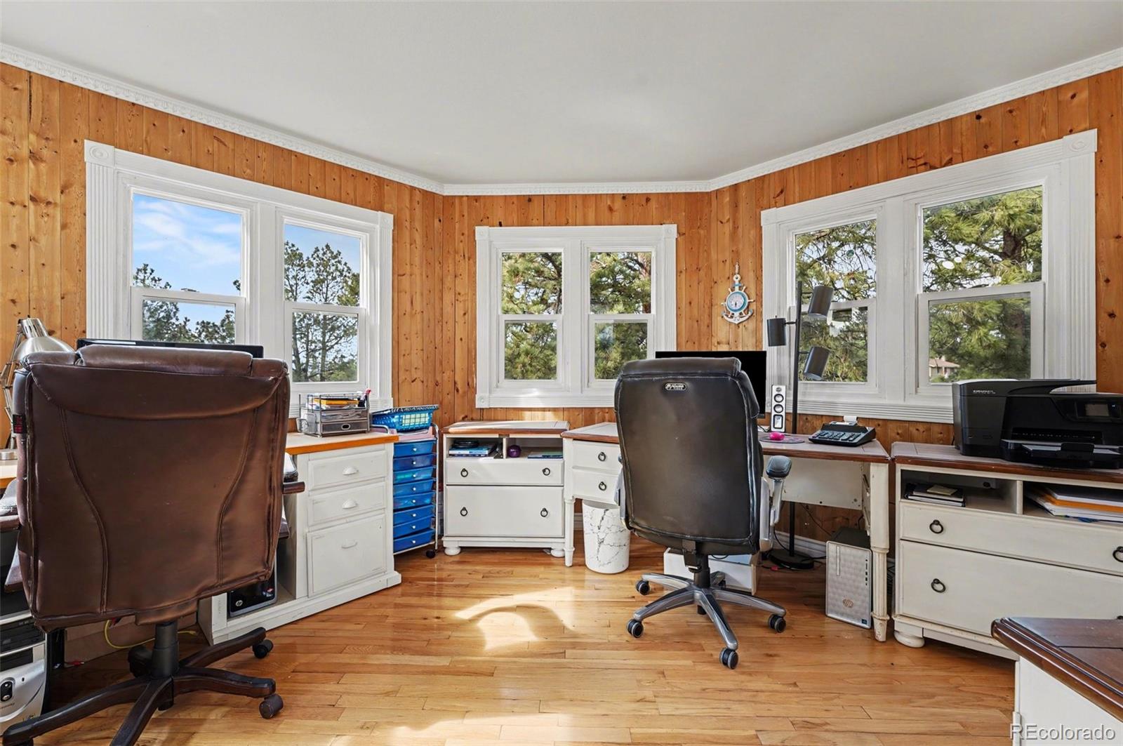6650 North Village Road Parker, CO 80134 - Photo 22 of 46 a view of a workspace with furniture and a window