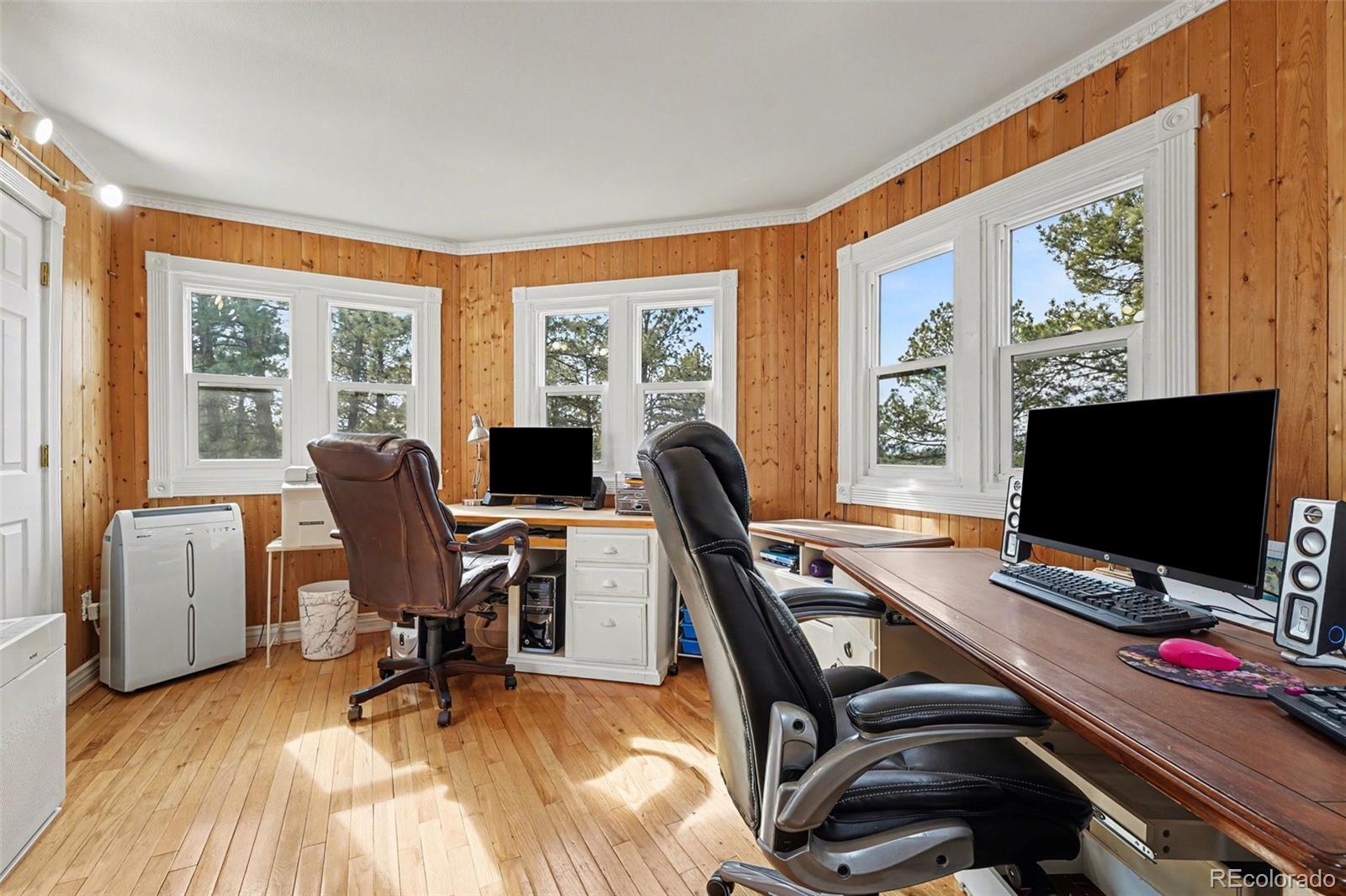 6650 North Village Road Parker, CO 80134 - Photo 23 of 46 a view of a workspace with furniture and a window