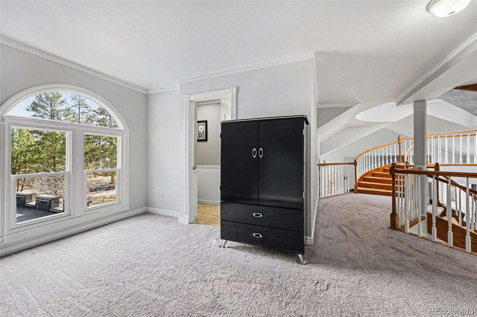 6650 North Village Road Parker, CO 80134 - Photo 25 of 46 an empty room with windows and cabinet