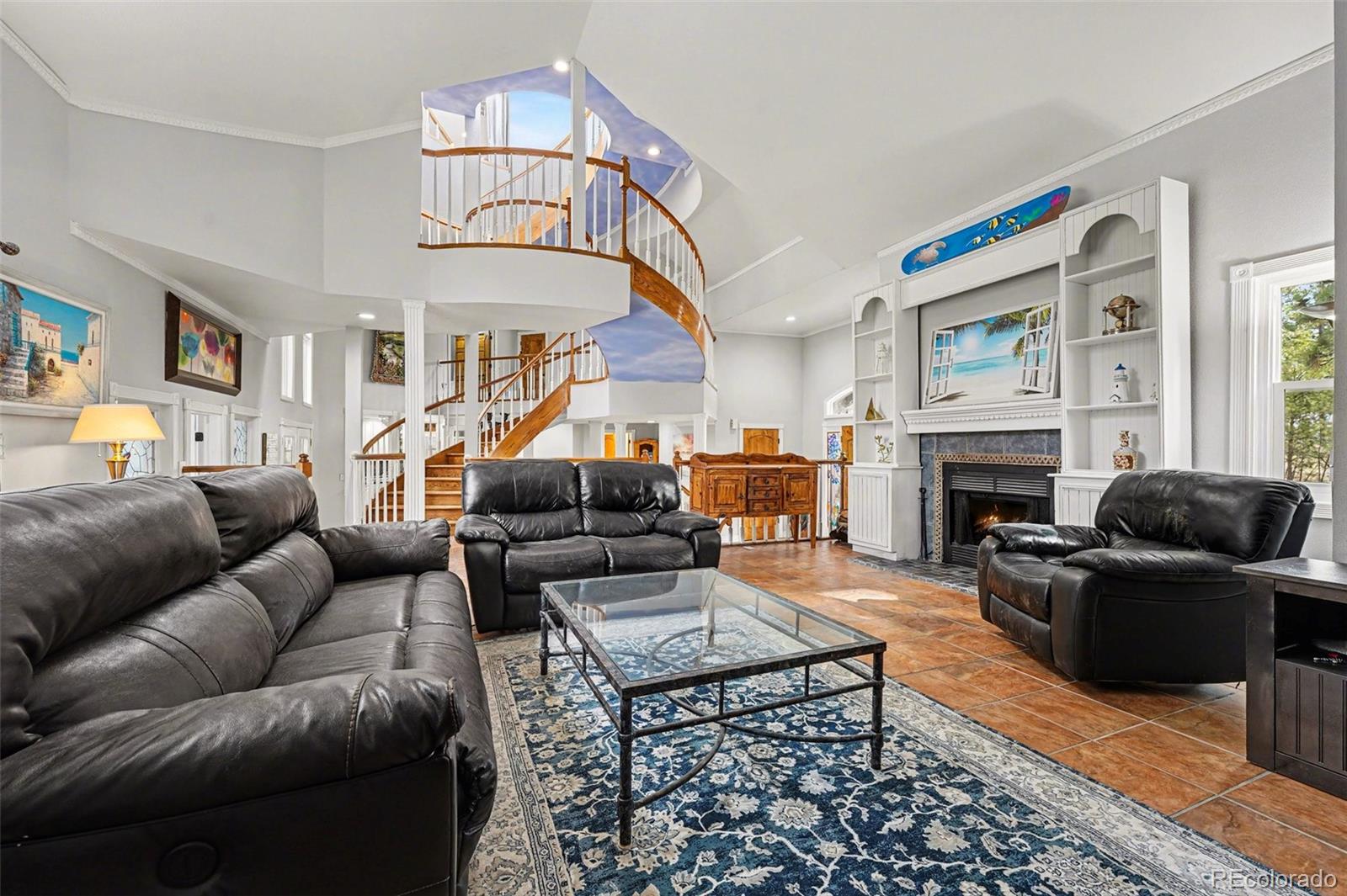6650 North Village Road Parker, CO 80134 - Photo 3 of 46 a living room with furniture ceiling fan and a fireplace