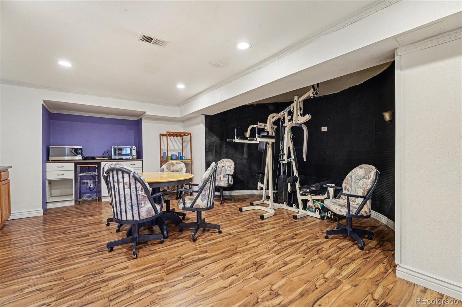 6650 North Village Road Parker, CO 80134 - Photo 33 of 46 a view of a room with gym equipment
