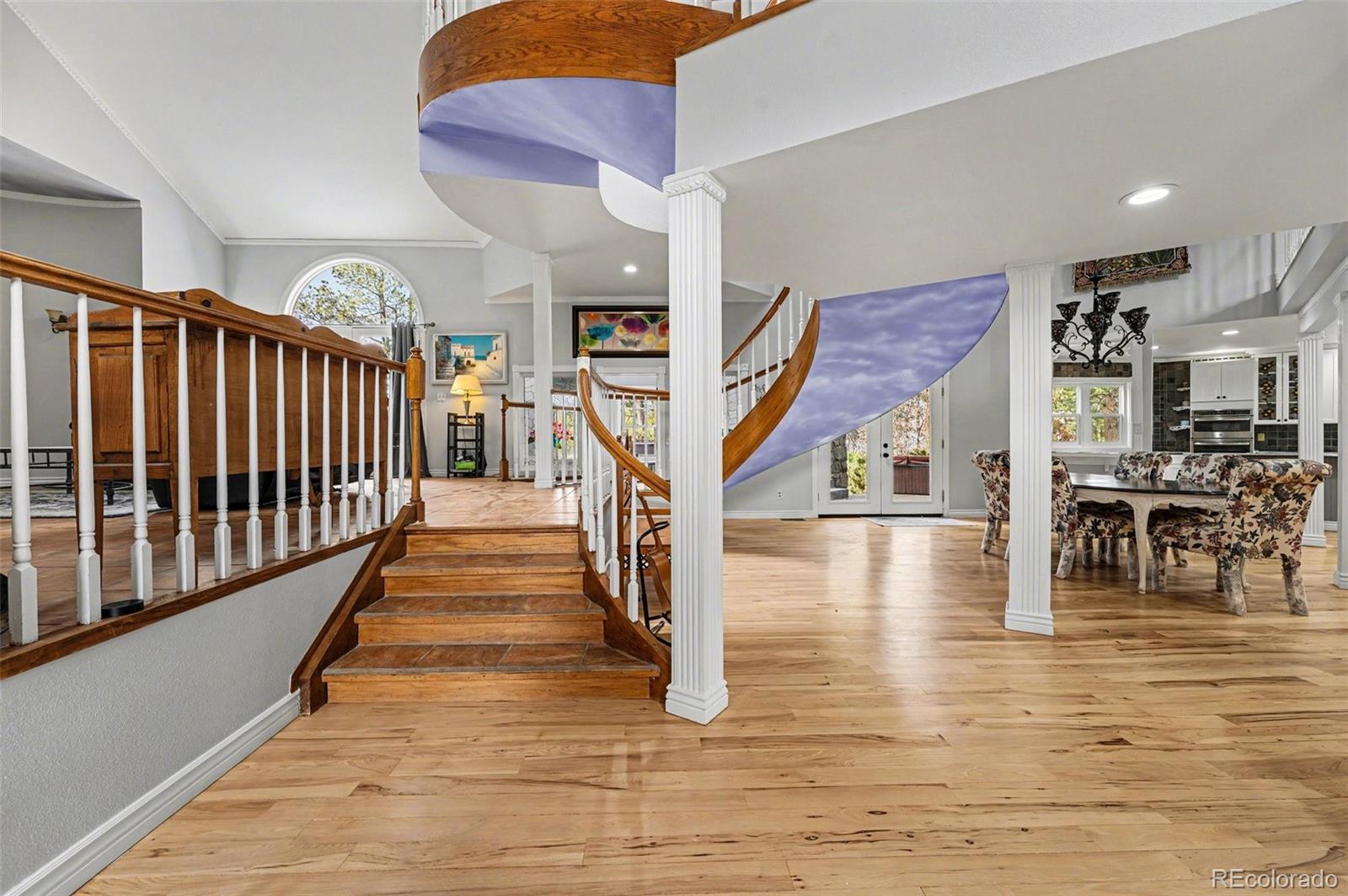 6650 North Village Road Parker, CO 80134 - Photo 5 of 46 a view of entryway and hall with wooden floor