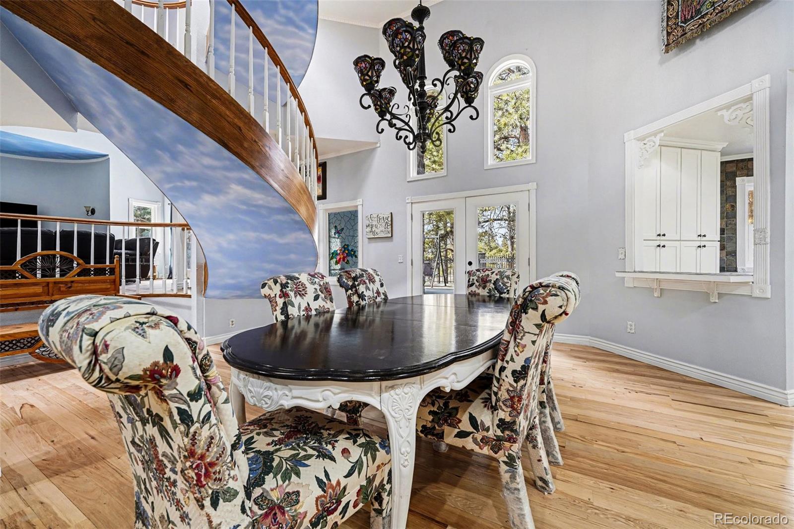 6650 North Village Road Parker, CO 80134 - Photo 6 of 46 a view of a dining room with furniture and wooden floor