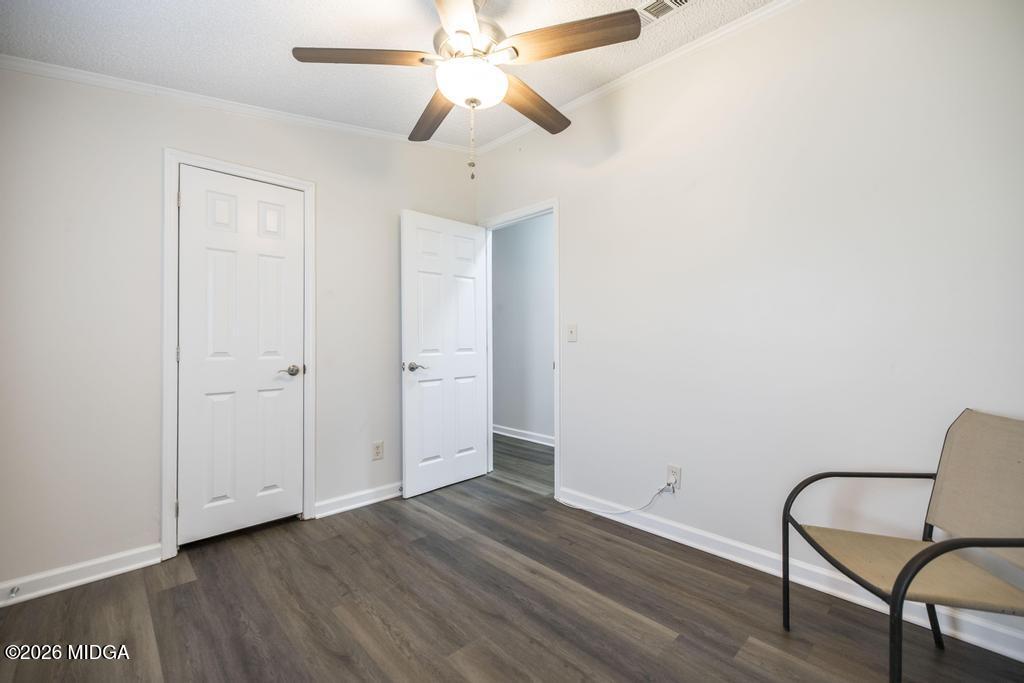 319 Pope Road Roberta, GA 31078 - Photo 26 of 42 a view of a room with wooden floor and windows