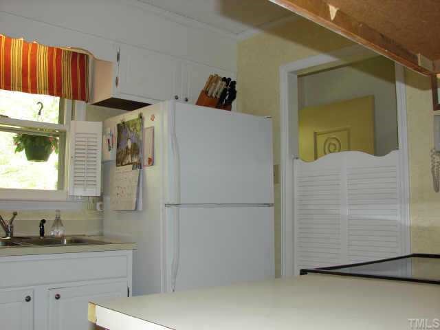 5620 Roslyn Road Durham, NC 27712 - Photo 3 of 10 Nice-n-Bright kitchen is dressed in white..