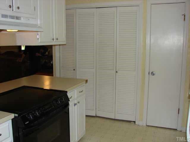 5620 Roslyn Road Durham, NC 27712 - Photo 4 of 10 with saloon doors, smooth top range & pantry closet too!
