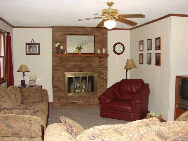 5620 Roslyn Road Durham, NC 27712 - Photo 5 of 10 Spacious Family room features woodburning fireplace & deck access too!
