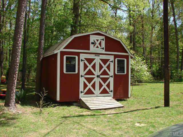 5620 Roslyn Road Durham, NC 27712 - Photo 10 of 10 1 of 2 sheds in the back... one is wired & has shelving for your creative side...