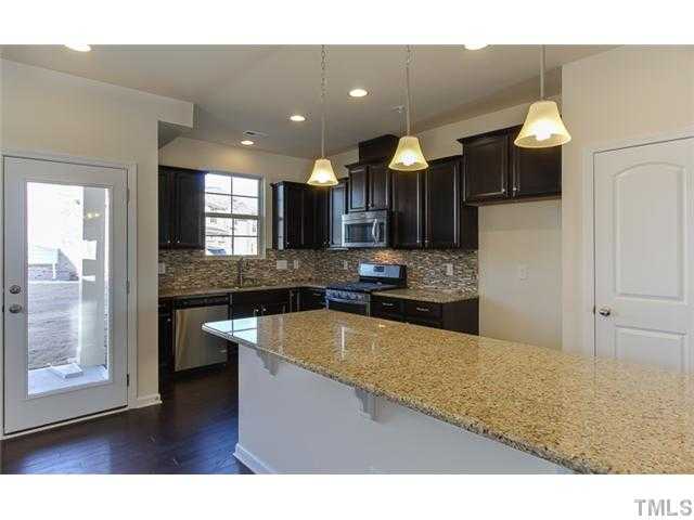 9307 Falkwood Road Raleigh, NC 27617 - Photo 3 of 12 Beautiful Open Kitchen with enormous island. A gourmet cooks dream! Photo is not of actual home.