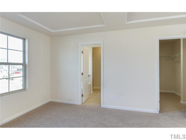 9307 Falkwood Road Raleigh, NC 27617 - Photo 6 of 12 Beautiful Master Bedroom with oversized walk in closet! Photo is not of actual home.