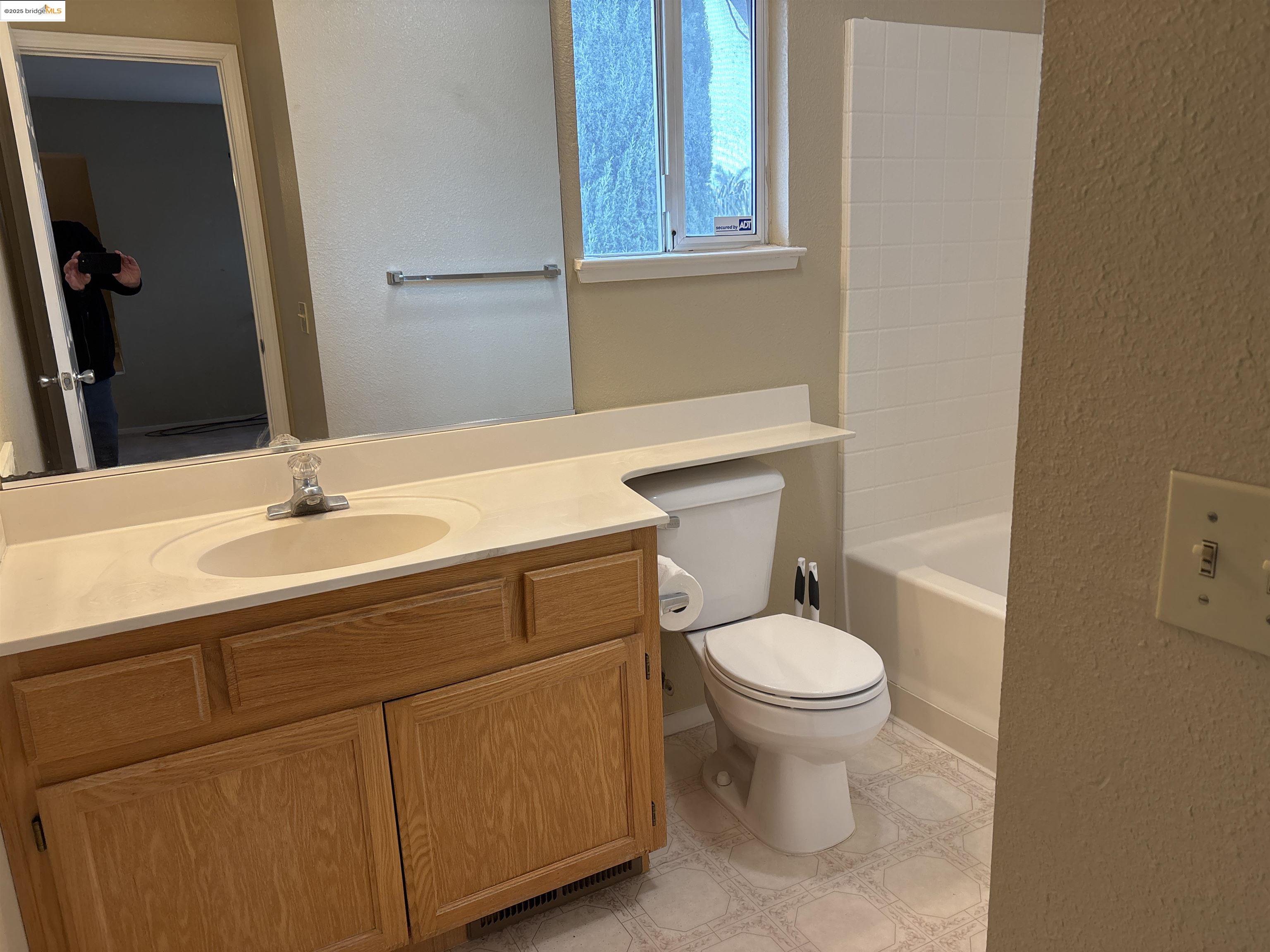 4612 Morningstar Lane Salida, CA 95368 - Photo 12 of 13 a bathroom with a sink toilet and a mirror