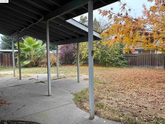 a view of a backyard of the house