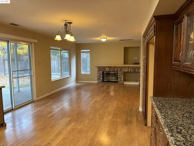 a view of livingroom with hardwood floor and a ceiling fan