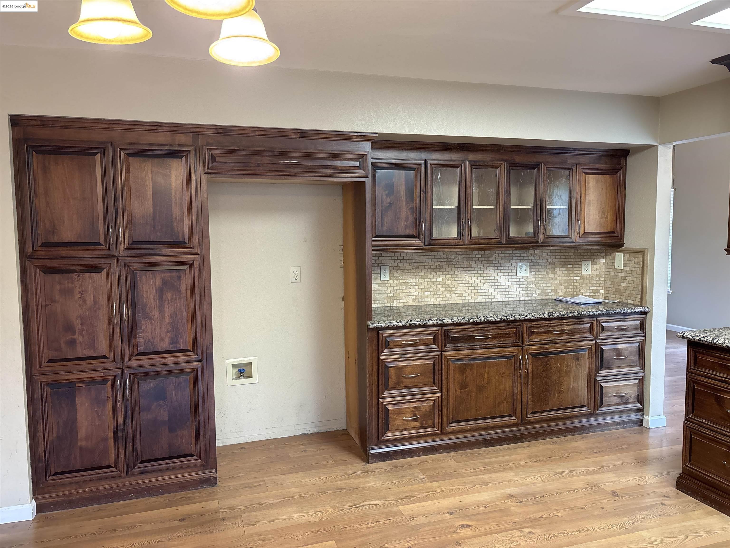 4612 Morningstar Lane Salida, CA 95368 - Photo 6 of 13 a kitchen with granite countertop wooden cabinets and stainless steel appliances
