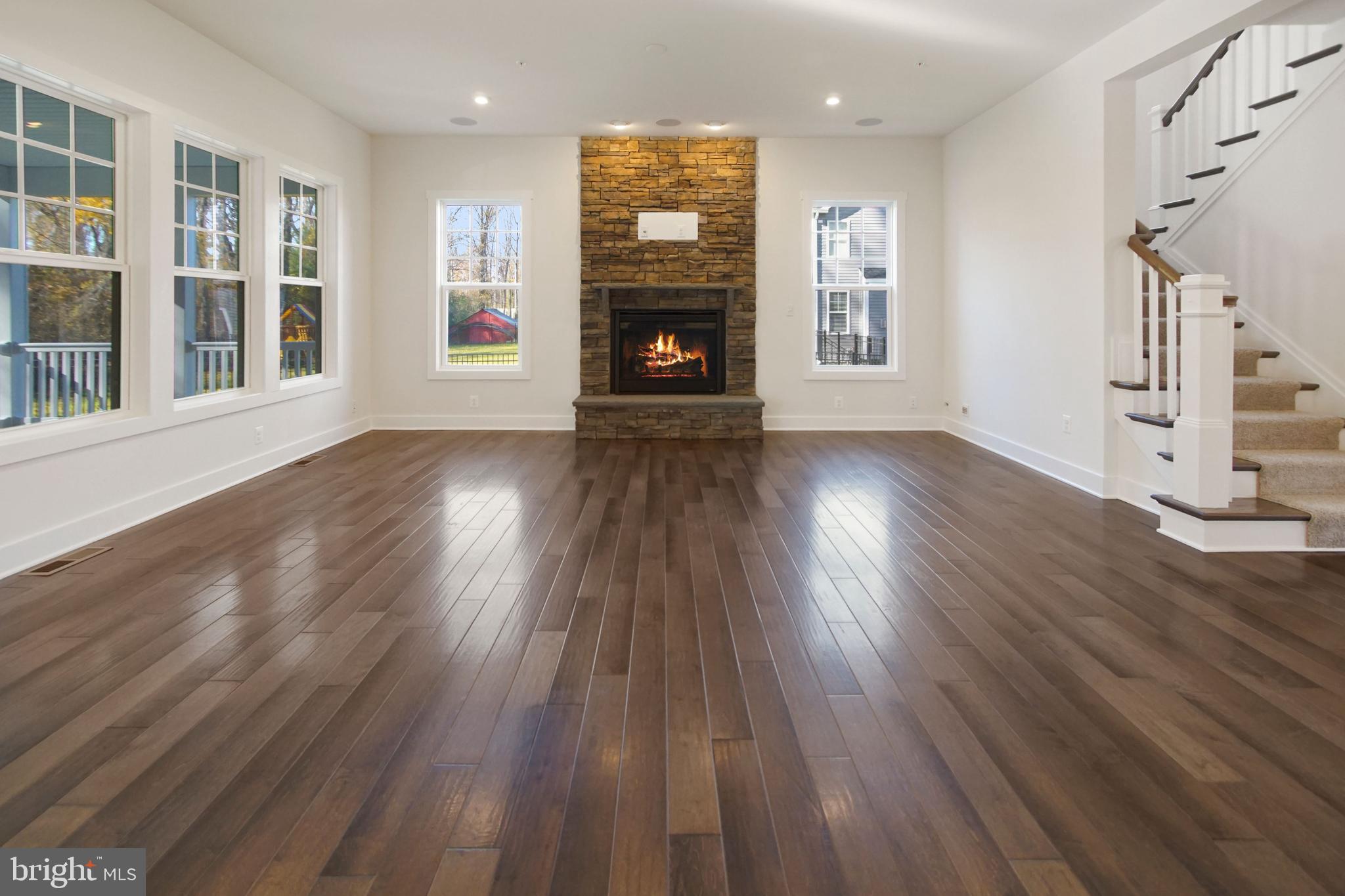 7 Copperleaf Boulevard Hanover, MD 21076 - Photo 19 of 46 a view of an empty room with wooden floor and a window