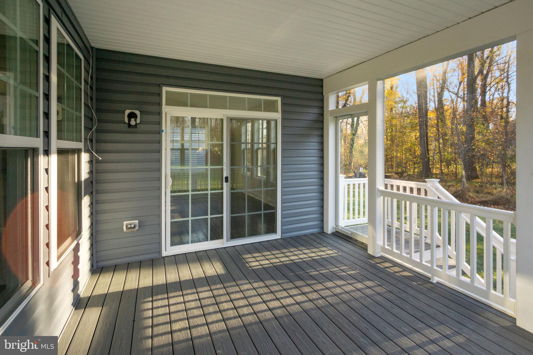 7 Copperleaf Boulevard Hanover, MD 21076 - Photo 28 of 46 a view of a porch with wooden floor and floor to ceiling window