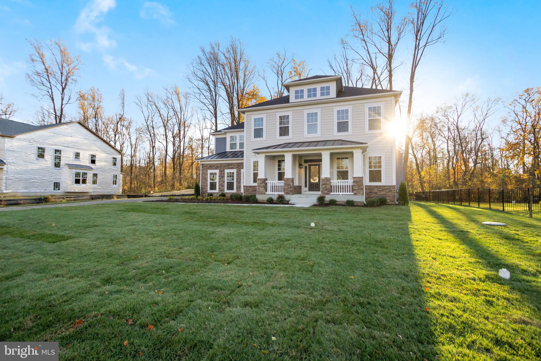 7 Copperleaf Boulevard Hanover, MD 21076 - Photo 3 of 46 a front view of a house with garden and trees