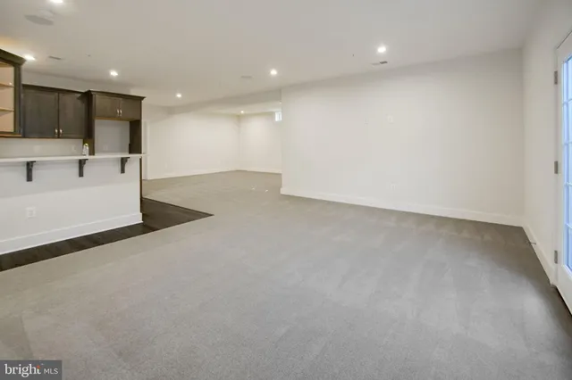 a view of kitchen with a sink and a refrigerator