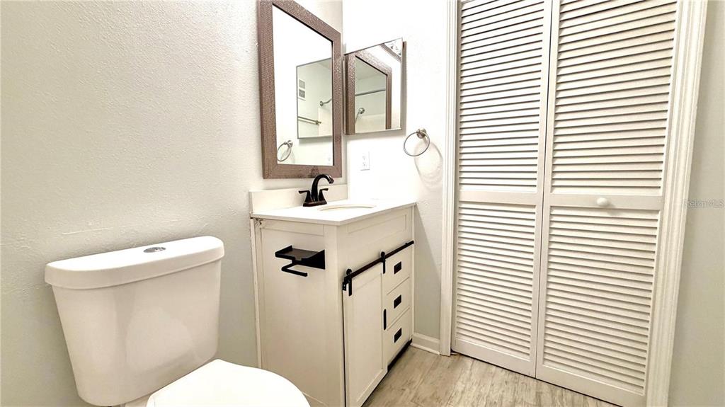 4332 South Kirkman Road, Unit 1012 Orlando, FL 32811 - Photo 12 of 20 a white toilet sitting next to a white sink