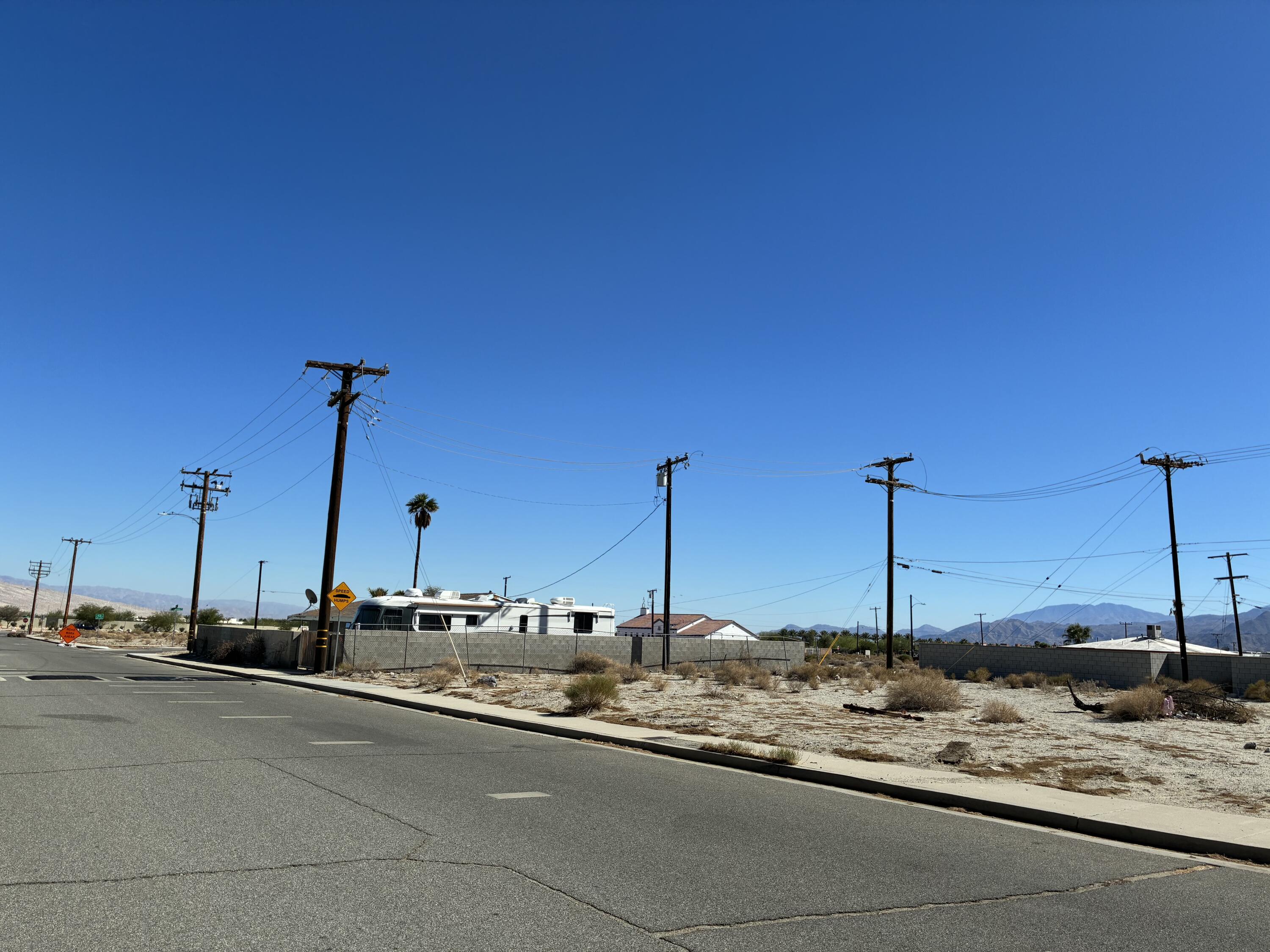 Lot 294 Tramview Road Palm Springs, CA 92262 - Photo 6 of 7 a view of an empty room with mirror on the wall