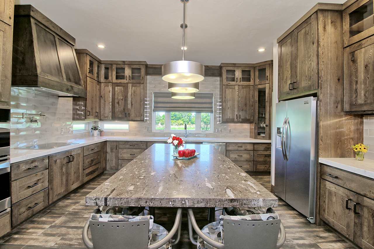 1724 K K 3/4 Road Fruita, CO 81521 - Photo 11 of 42 a kitchen with kitchen island granite countertop a sink stainless steel appliances and cabinets