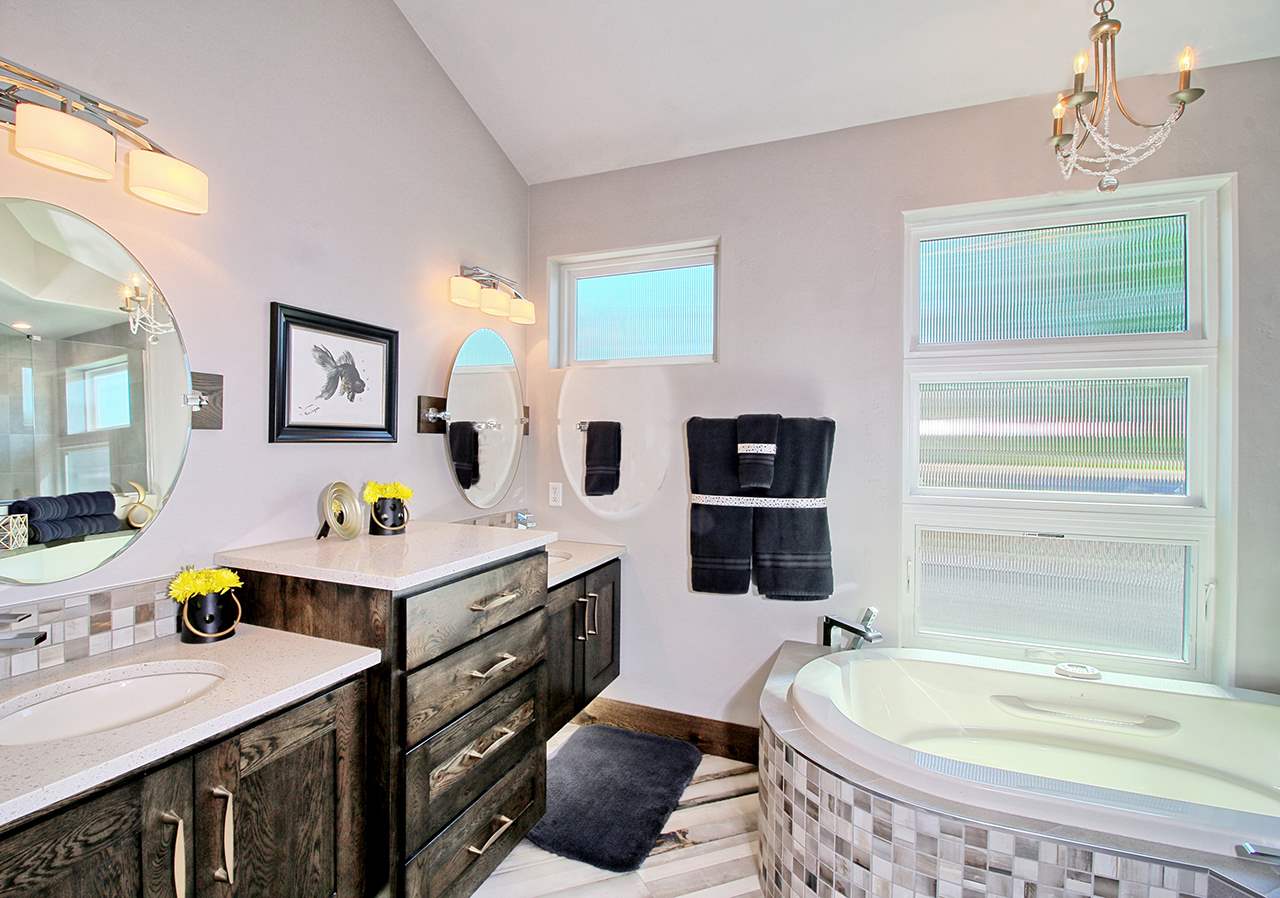 1724 K K 3/4 Road Fruita, CO 81521 - Photo 13 of 42 a bathroom with a tub sink and mirror
