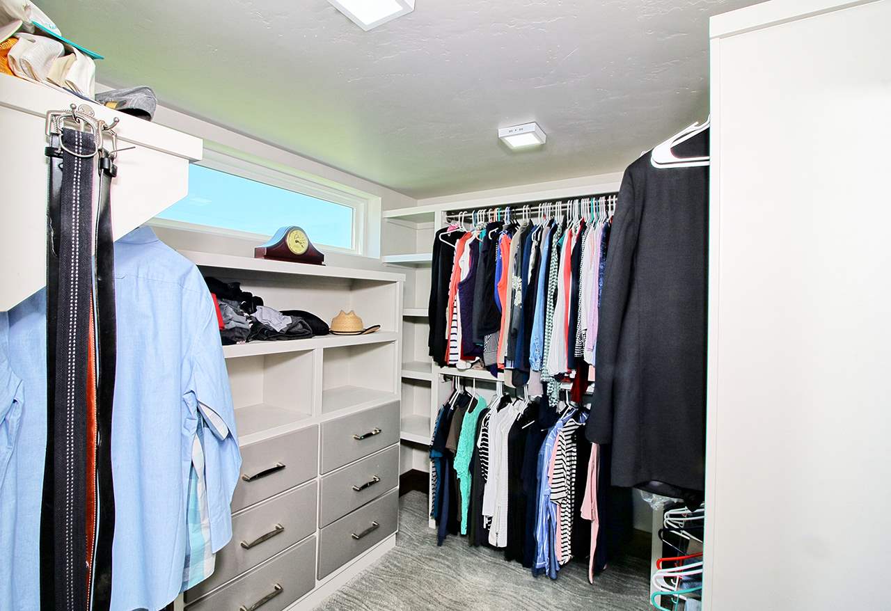 1724 K K 3/4 Road Fruita, CO 81521 - Photo 18 of 42 a view of walk in closet with clothes and shoes
