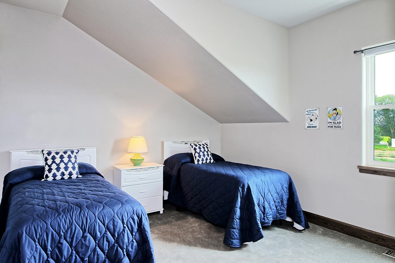 1724 K K 3/4 Road Fruita, CO 81521 - Photo 23 of 42 a bedroom with a bed lamp and window