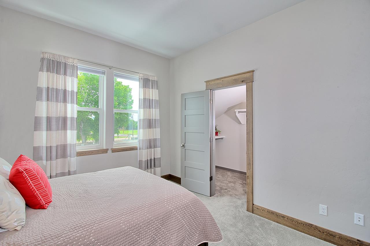 1724 K K 3/4 Road Fruita, CO 81521 - Photo 26 of 42 a bedroom with a bed and a window