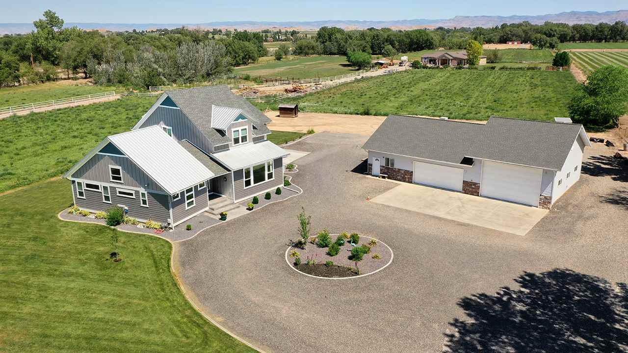1724 K K 3/4 Road Fruita, CO 81521 - Photo 3 of 42 an aerial view of a house with outdoor space