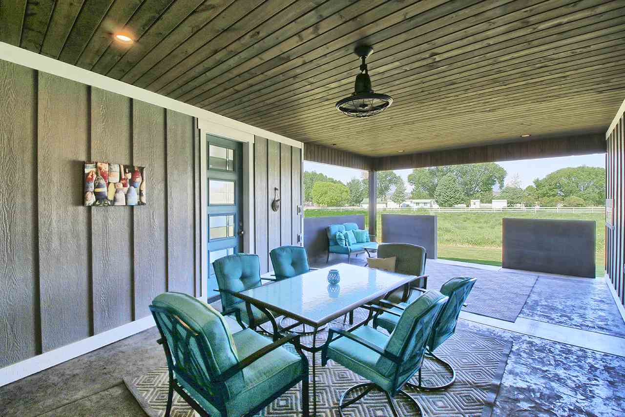1724 K K 3/4 Road Fruita, CO 81521 - Photo 32 of 42 a view of a patio with a table and chairs