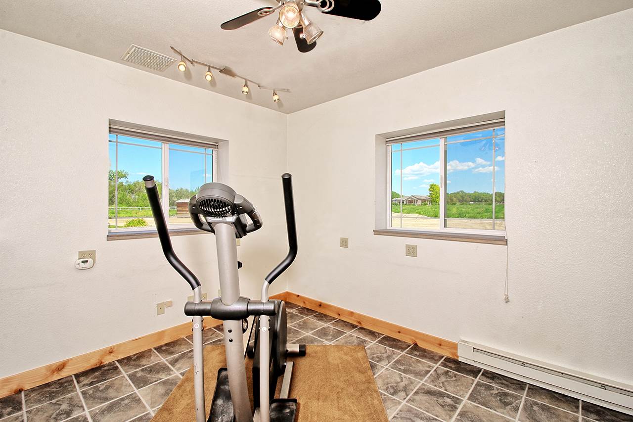 1724 K K 3/4 Road Fruita, CO 81521 - Photo 39 of 42 a view of a room with gym equipment