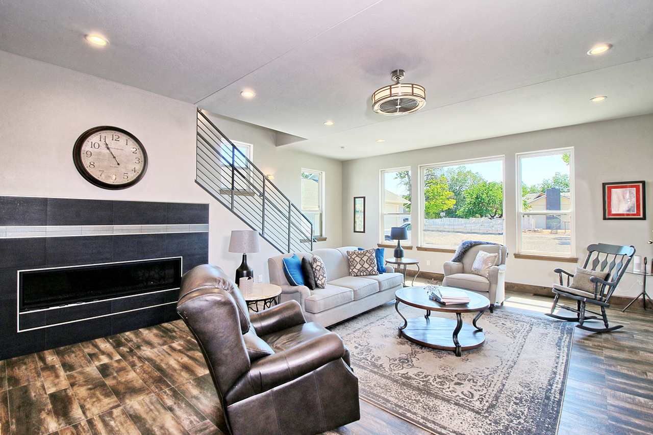 1724 K K 3/4 Road Fruita, CO 81521 - Photo 7 of 42 a living room with furniture and a fireplace