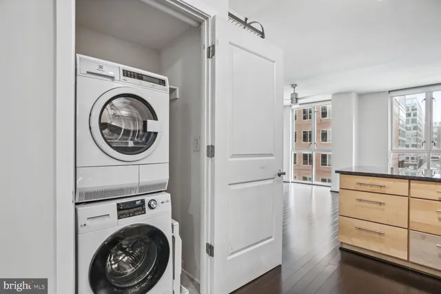 a view of a storage and utility room with washer and dryer