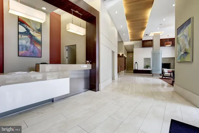 a living room with fireplace furniture and a flat screen tv