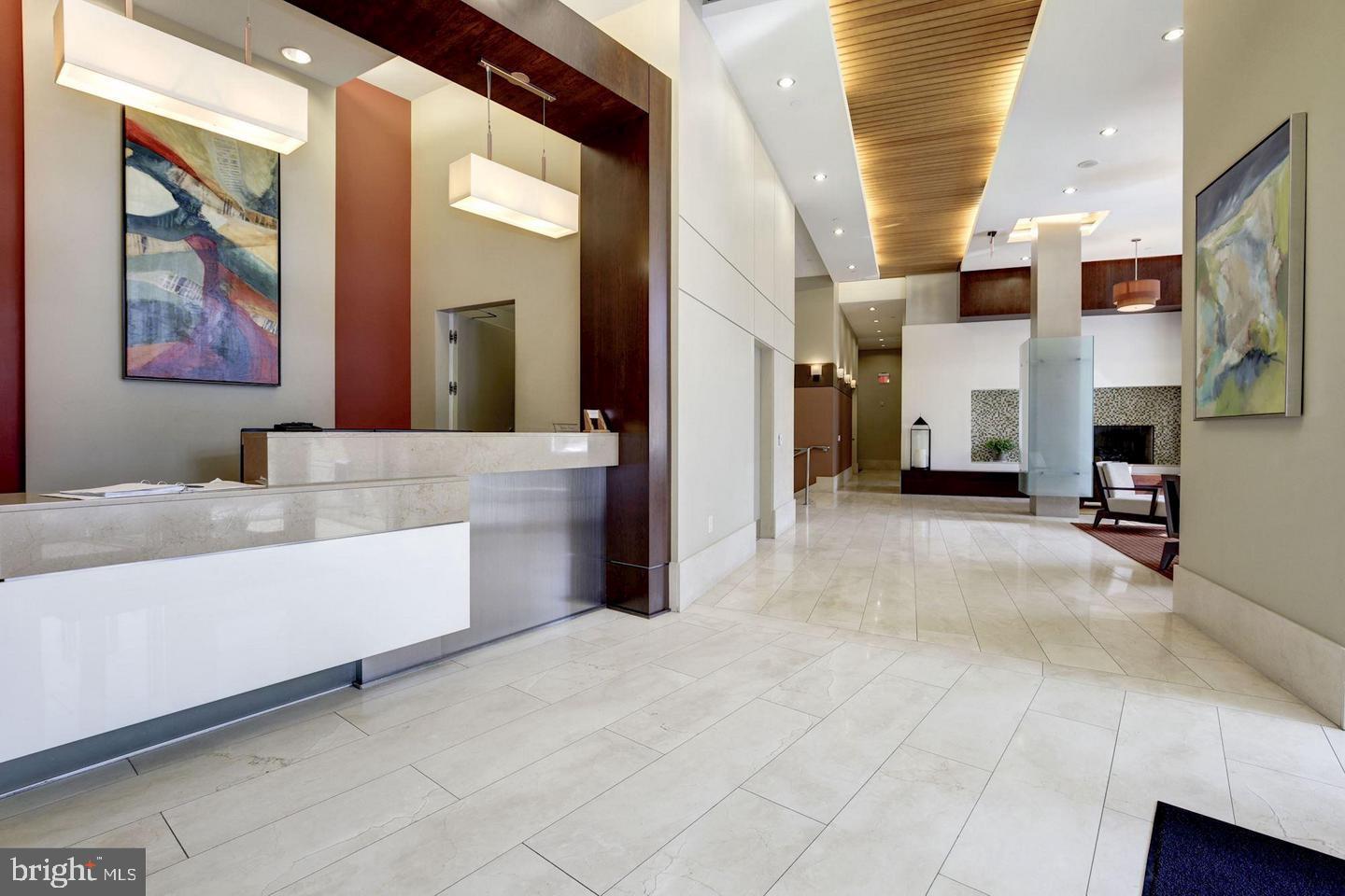 1025 First Street Southeast, Unit 507 Washington, DC 20003 - Photo 18 of 18 a living room with fireplace furniture and a flat screen tv