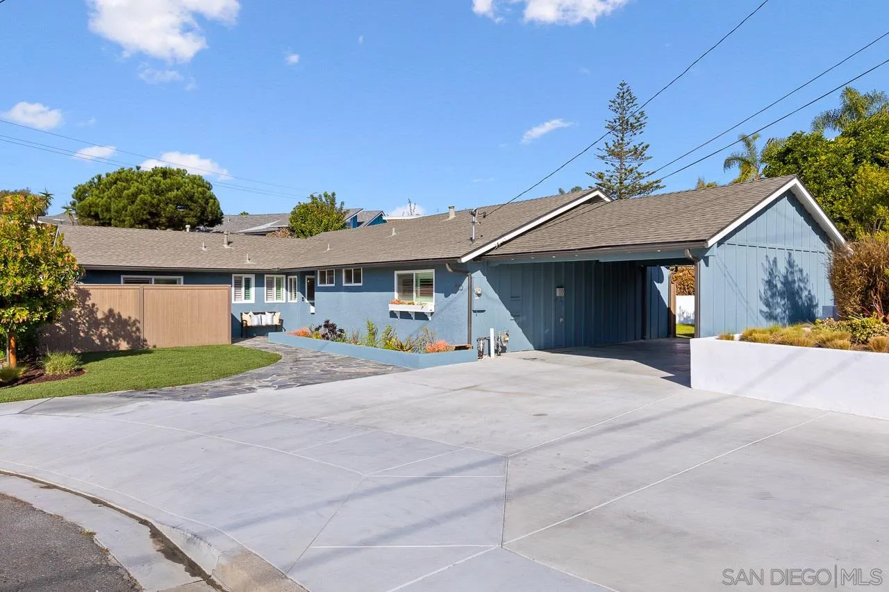 910 Edwina Way Cardiff, CA 92007 - Photo 29 of 30 a front view of a house with a yard and garage